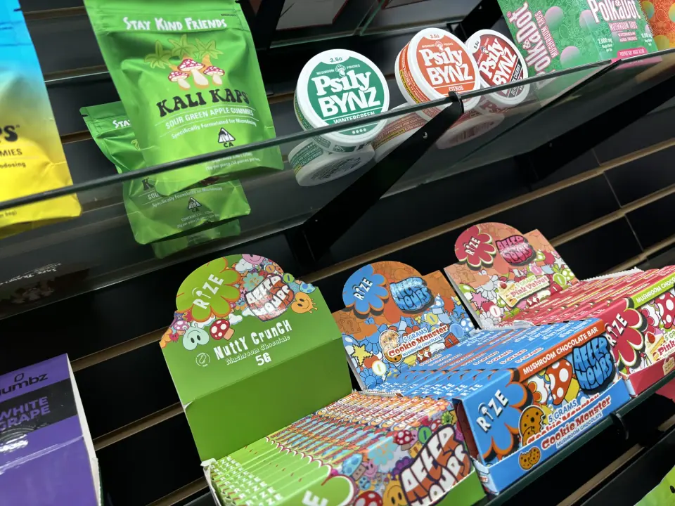 Mushroom gummies and packaged mushroom products displayed in the shop