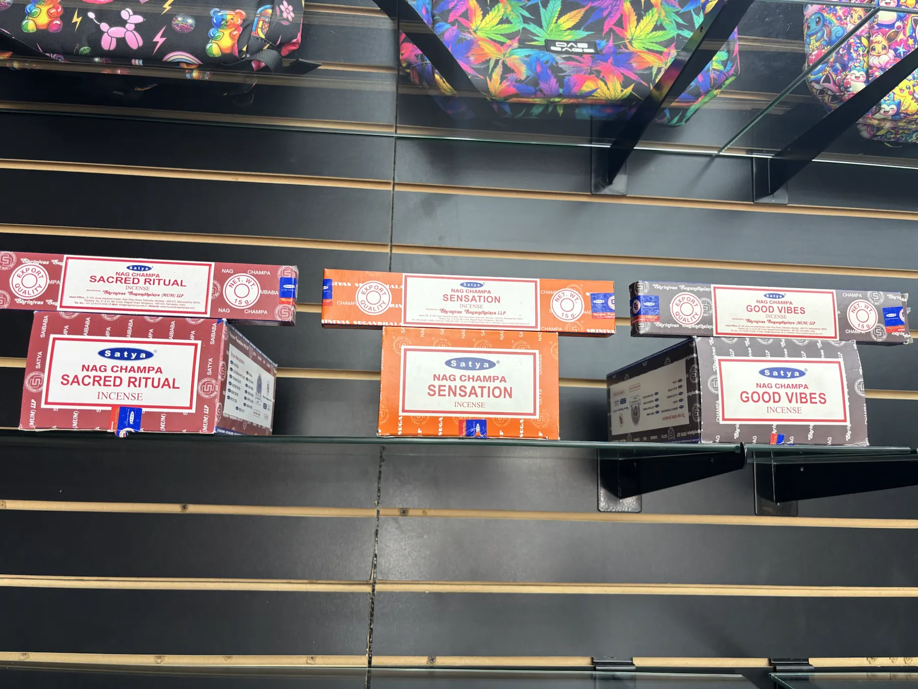 Nag Champa incense selection beneath colorful bags